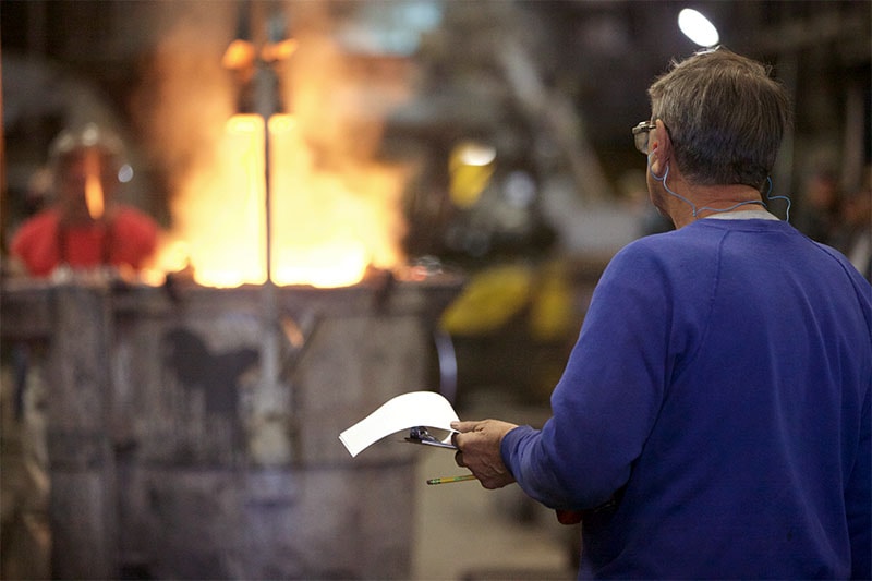 Dakota Foundry inspecting while pouring a mold