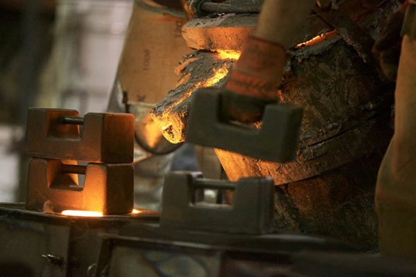 Pouring Molten Iron in mould