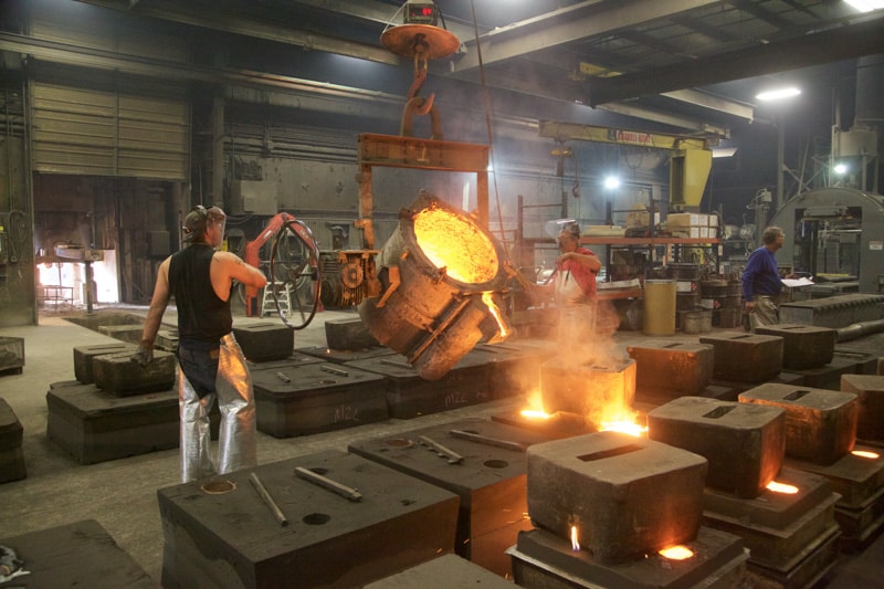 Pouring iron into molds at Dakota Foundry