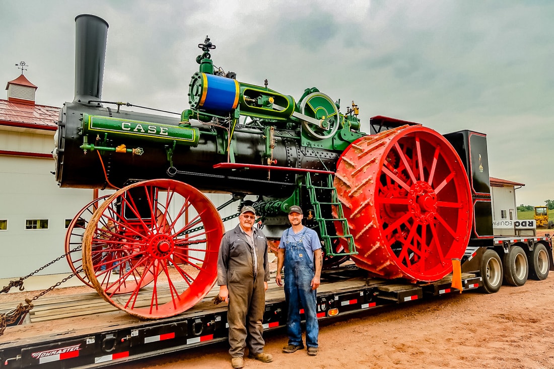 Kory Anderson and Mark Davidson, the truck driver who volunteered his time and costs to haul the brand new 150 HP Case steam traction engine from Gary Bradley’s shop in Sheridan, WY (where it was assembled) to its home in Andover, SD.